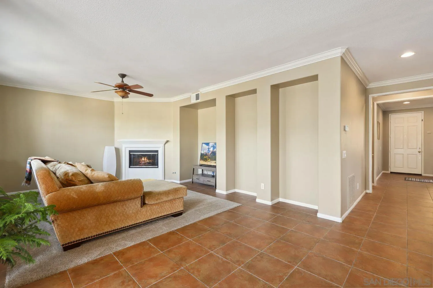 1166 Midnight Way Oceanside, CA 92057 - Photo 3 of 37 a living room with furniture and a fireplace