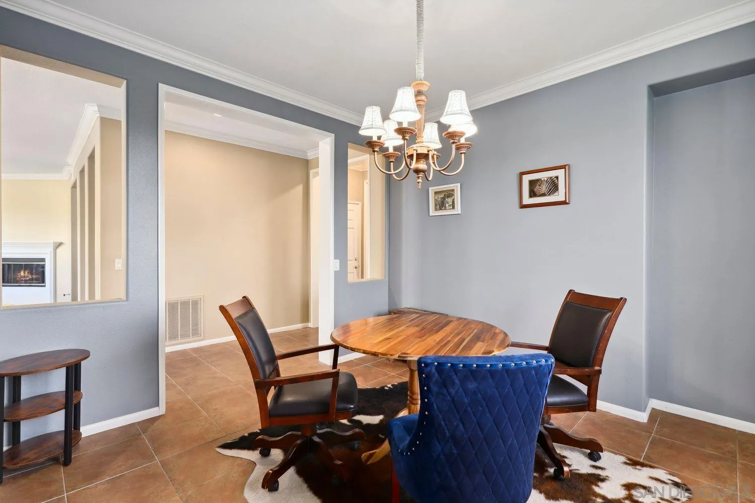 1166 Midnight Way Oceanside, CA 92057 - Photo 10 of 37 a view of a dining room with furniture and chandelier
