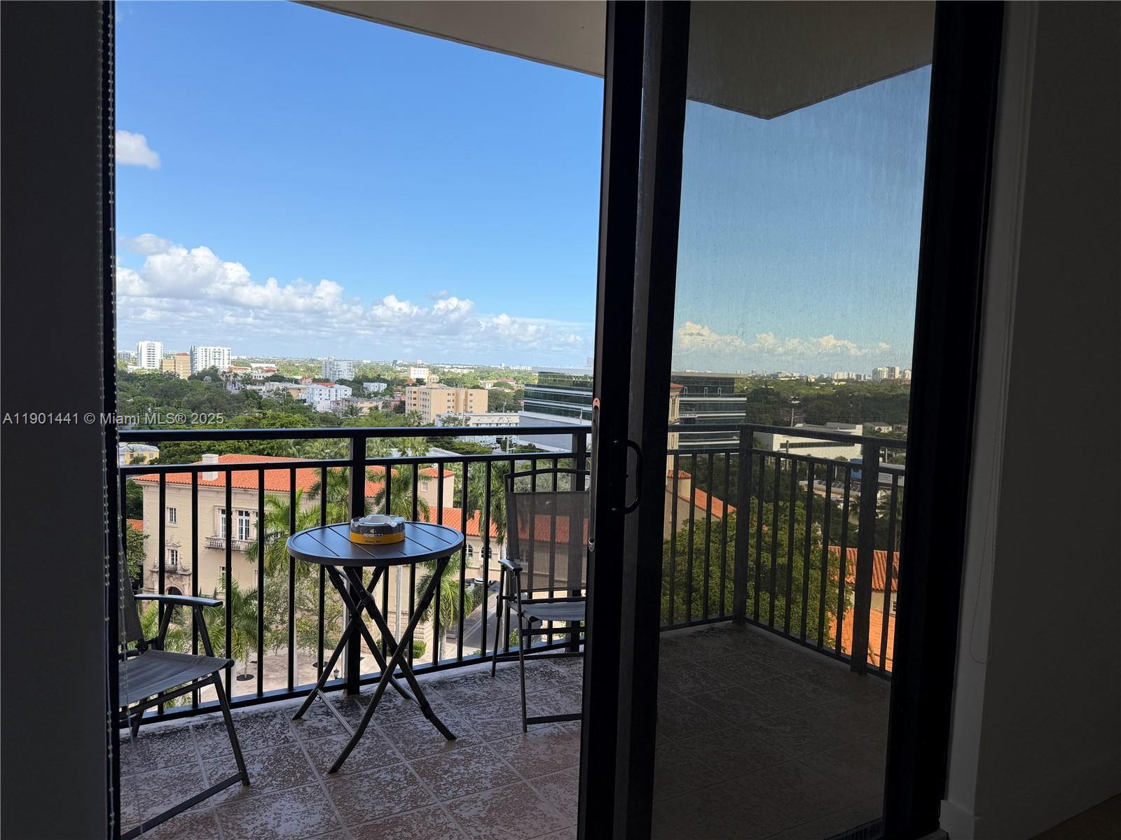 888 Douglas Road, Unit 917 Coral Gables, FL 33134 - Photo 15 of 31 a view of a city from a balcony