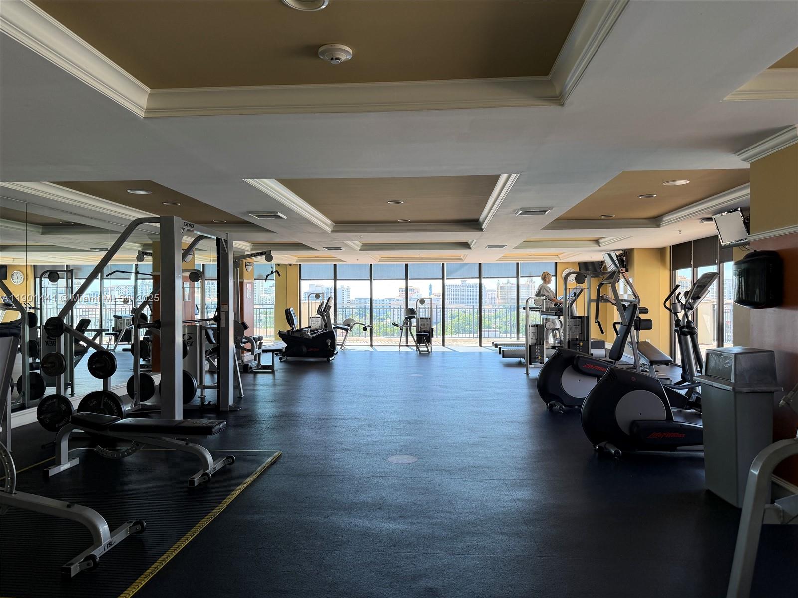 888 Douglas Road, Unit 917 Coral Gables, FL 33134 - Photo 25 of 31 a view of a room with gym equipment