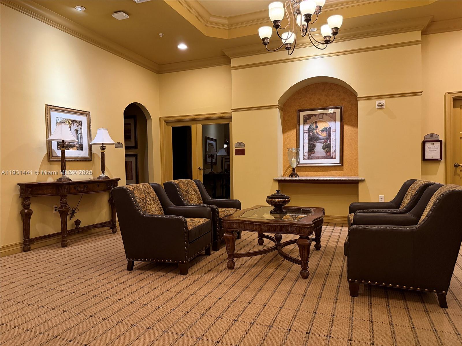 888 Douglas Road, Unit 917 Coral Gables, FL 33134 - Photo 31 of 31 a living room with furniture and a chandelier