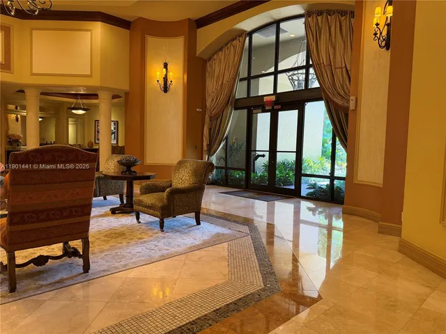a living room filled with furniture and a window