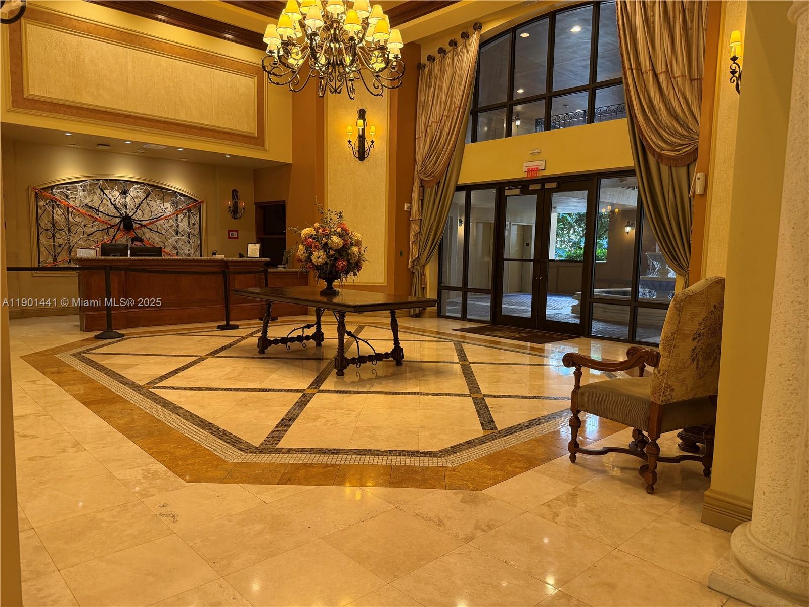 888 Douglas Road, Unit 917 Coral Gables, FL 33134 - Photo 5 of 31 a building outdoor space with patio furniture and potted plants