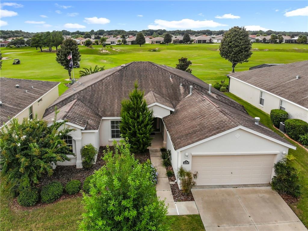 16288 Southwest 14th Avenue Road Ocala, FL 34473 - Photo 1 of 1 an aerial view of a house with green space and lake view