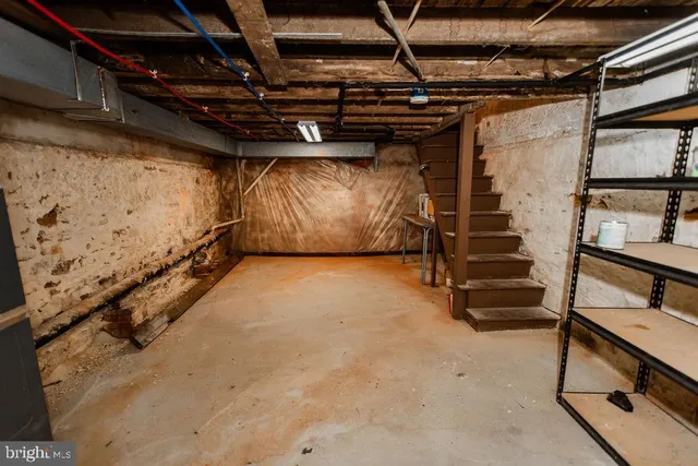 a view of an empty room with stairs