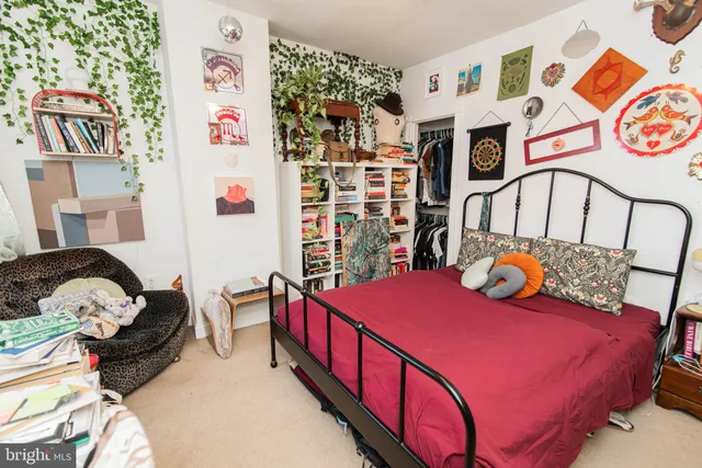 a bedroom with bed and a window