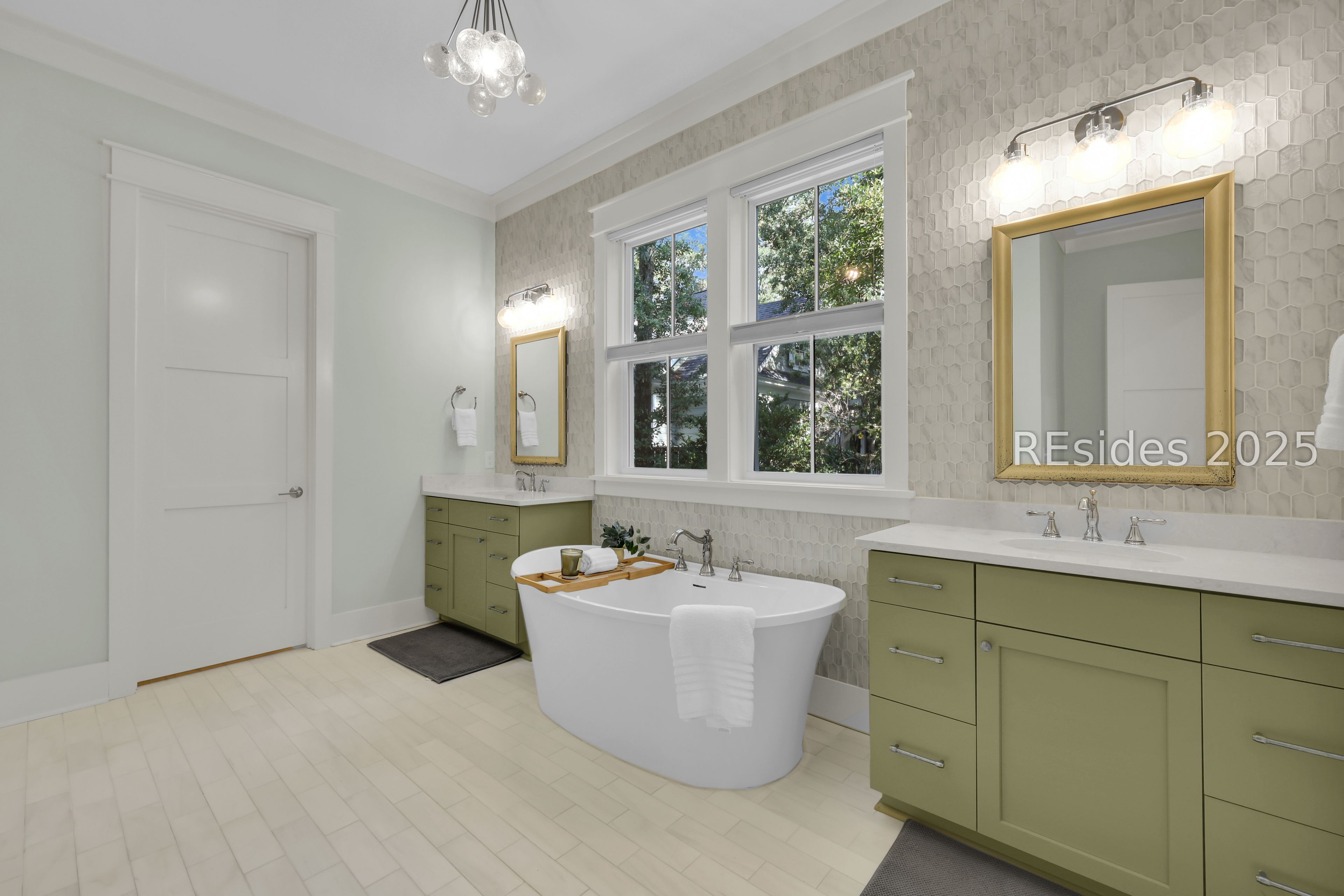 2 Oldfield Village Road Bluffton, SC 29909 - Photo 12 of 37 Twin vanities flank the primary bath soaking tub