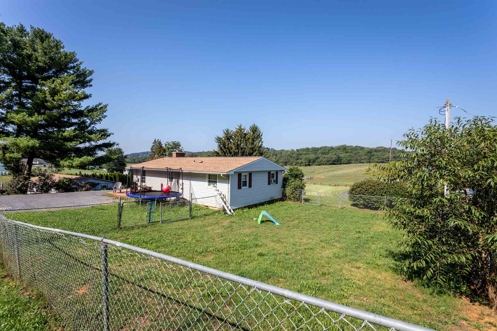 3205 Oak Ridge Road Mount Crawford, VA 22841 - Photo 26 of 31 a view of a house with a big yard and large trees