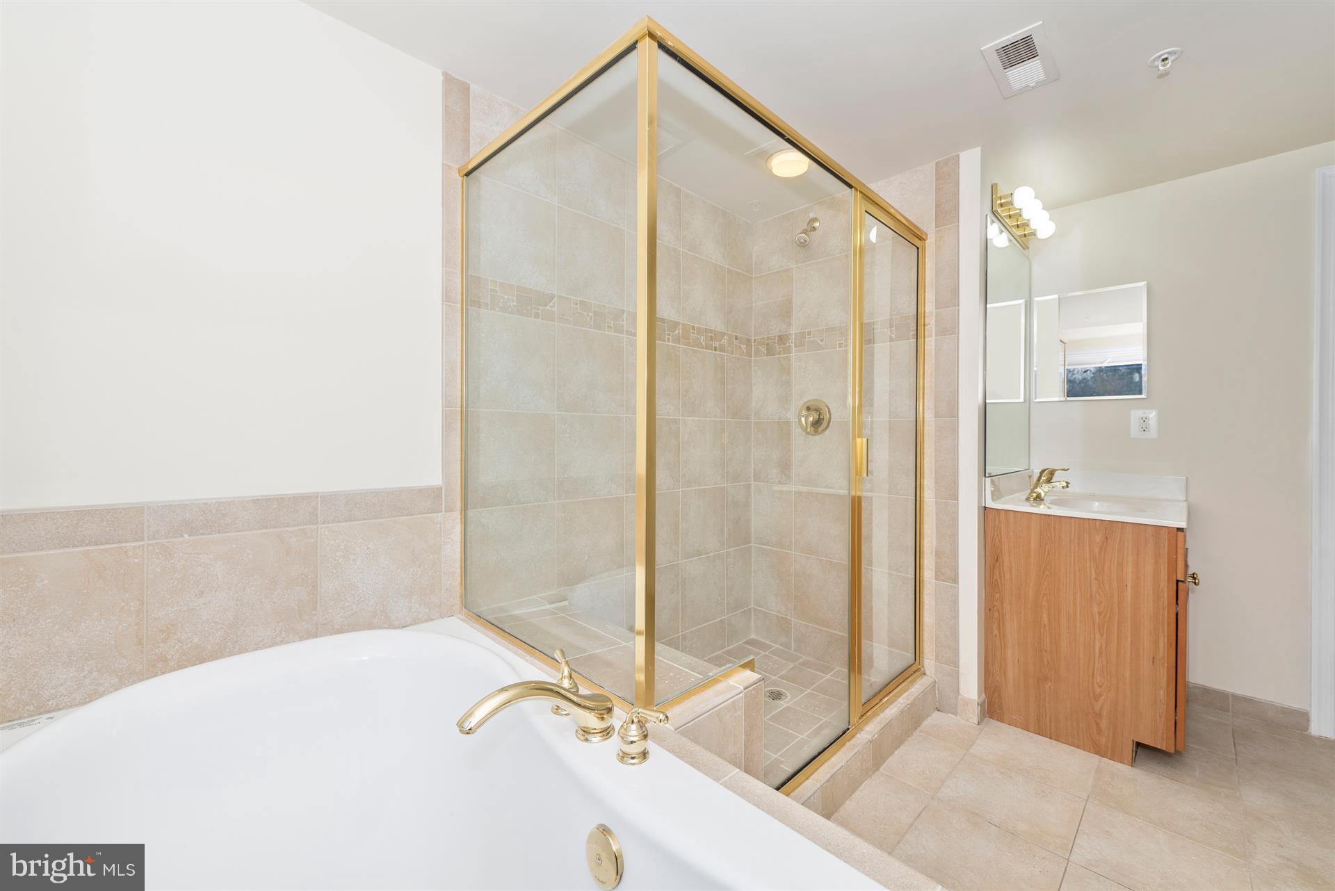 129 South Market Street Frederick, MD 21701 - Photo 11 of 37 a bathroom with a shower and a sink