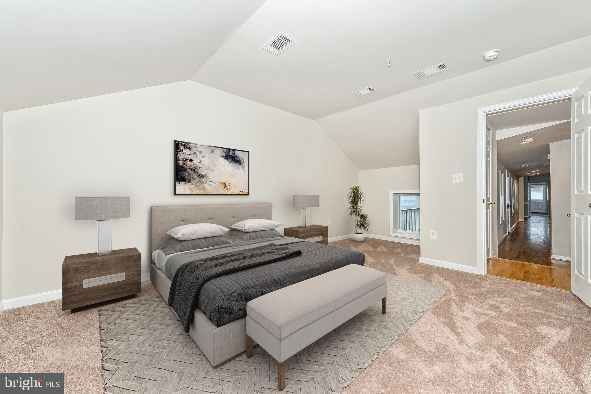 129 South Market Street Frederick, MD 21701 - Photo 12 of 37 a spacious bedroom with a bed and a large mirror