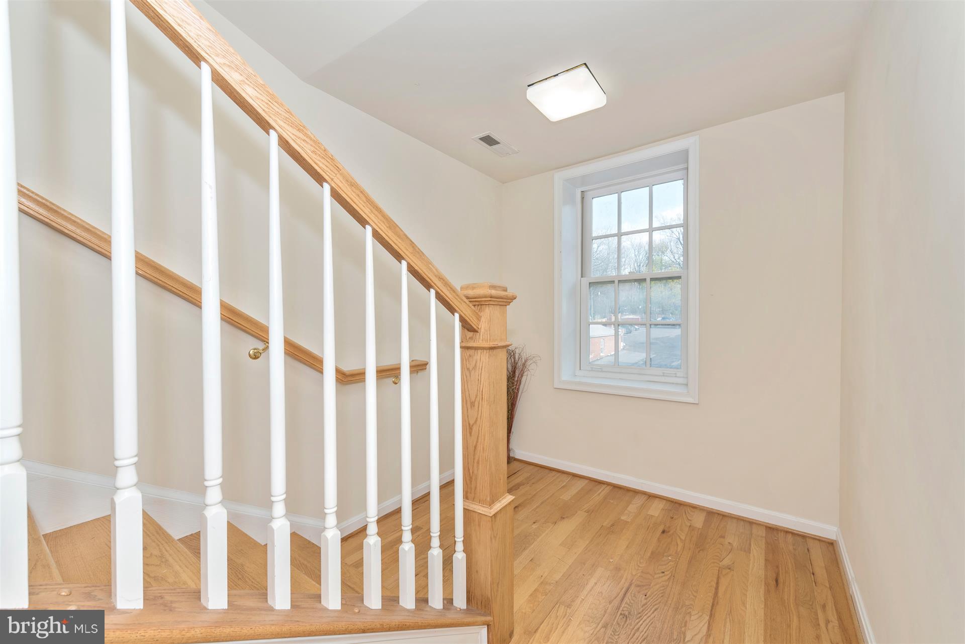129 South Market Street Frederick, MD 21701 - Photo 16 of 37 a view of an entryway with wooden floor and door