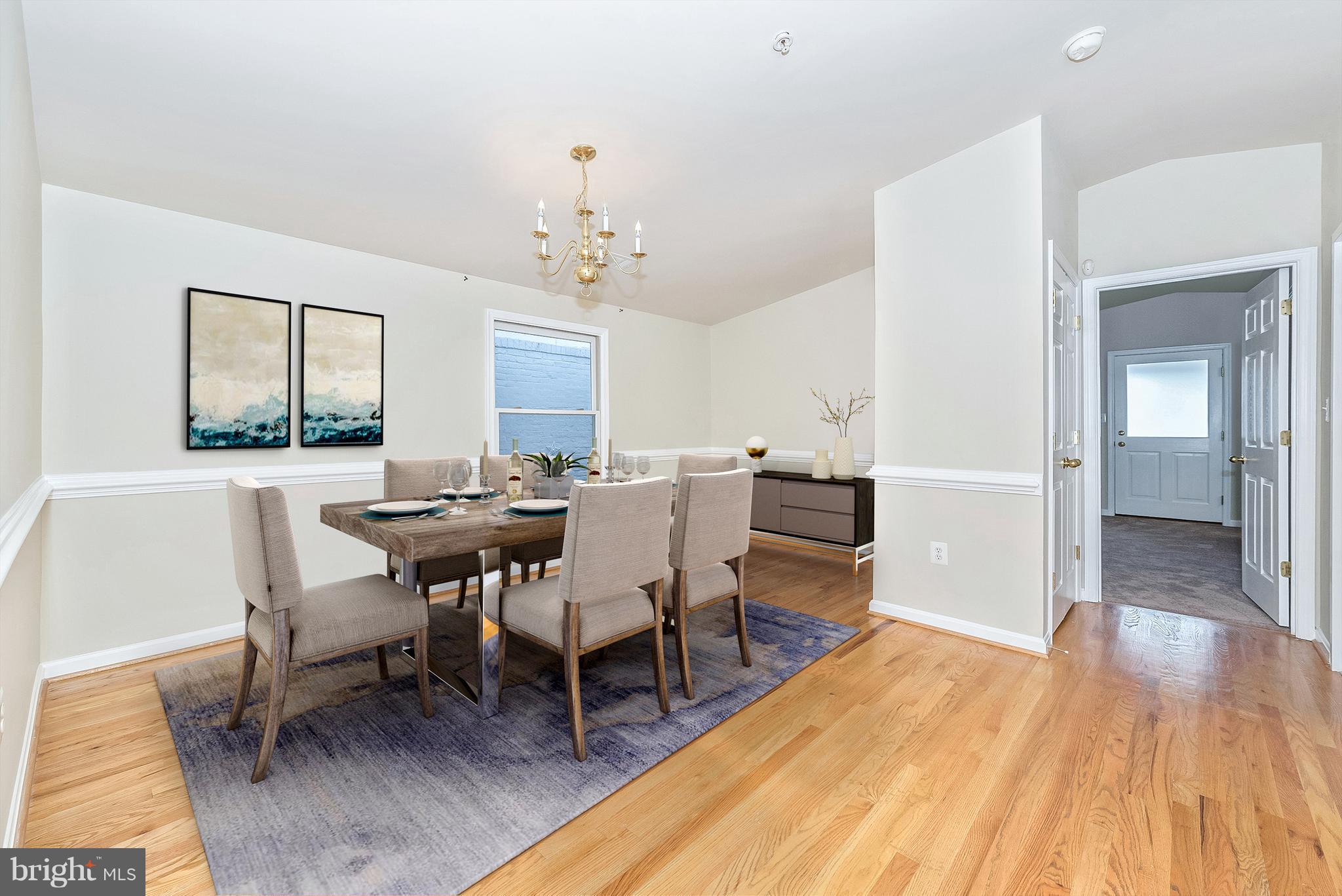 129 South Market Street Frederick, MD 21701 - Photo 6 of 37 a view of a dining room with furniture and wooden floor