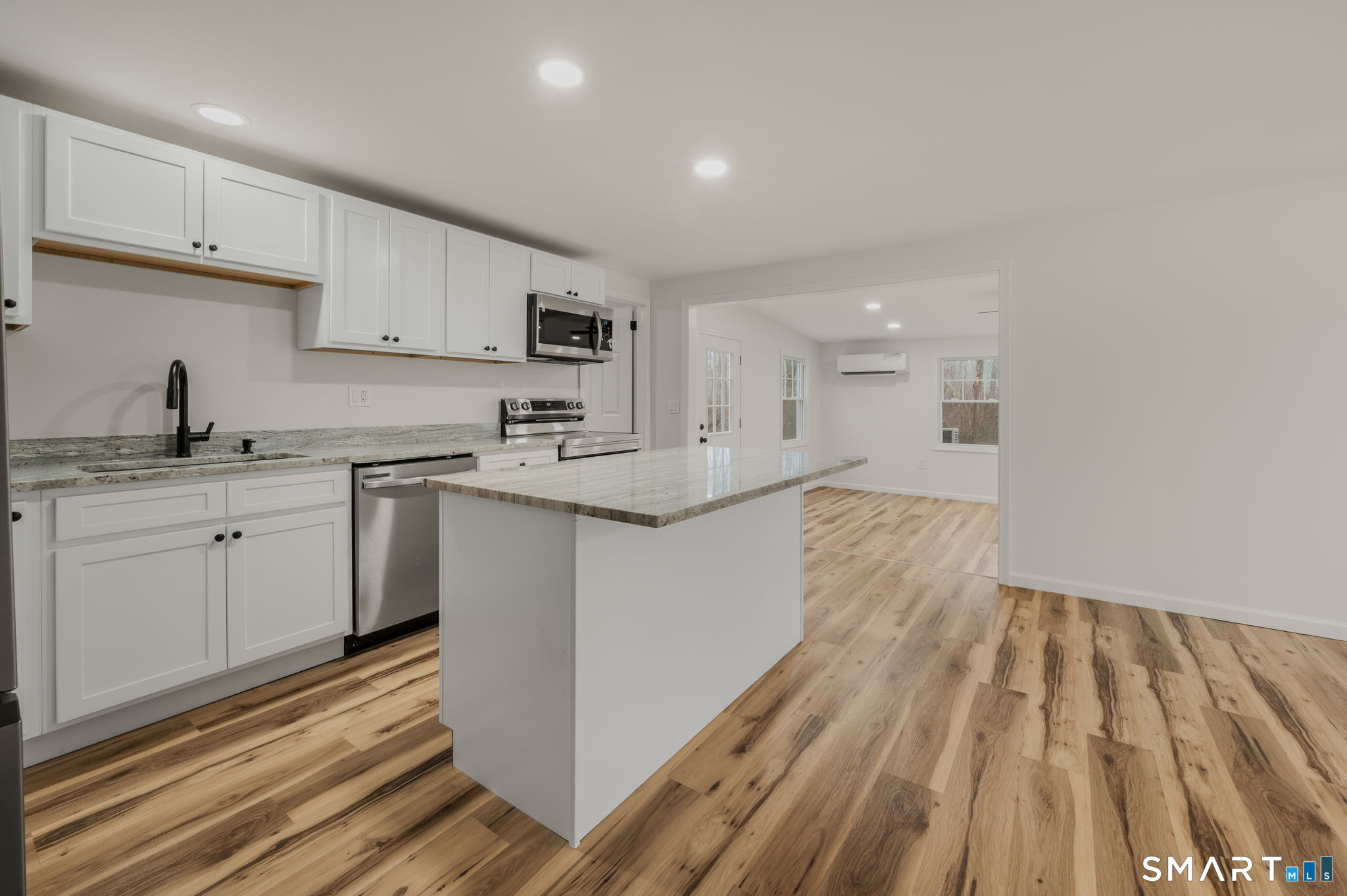 153 Meeting House Lane Ledyard, CT 06339 - Photo 12 of 39 a kitchen with a sink window and cabinets