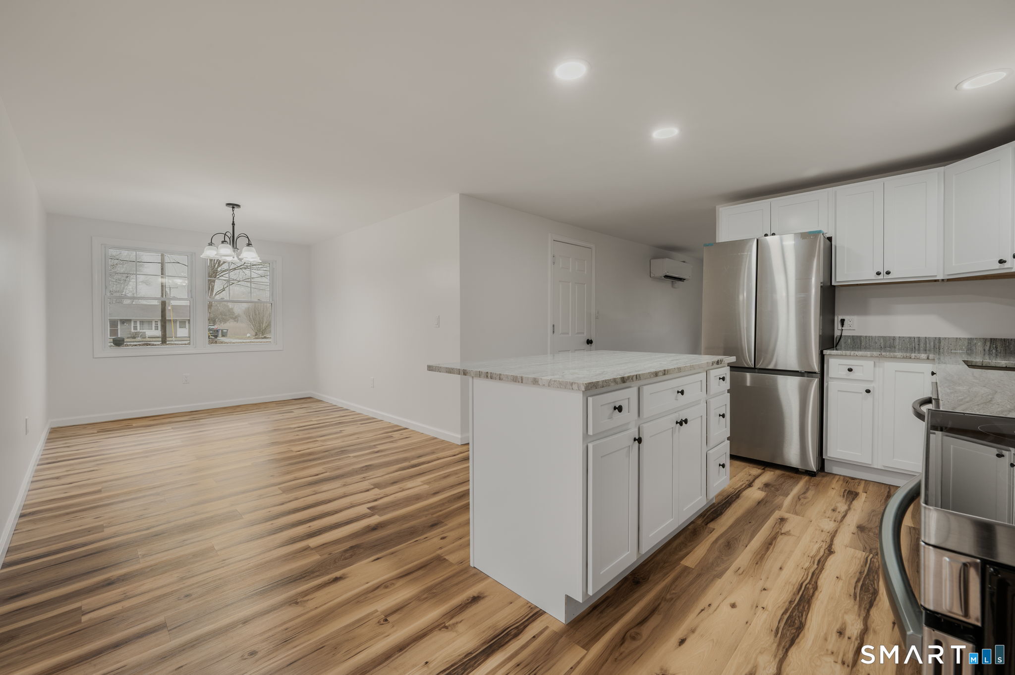 153 Meeting House Lane Ledyard, CT 06339 - Photo 14 of 39 a kitchen with cabinets appliances and a wooden floor