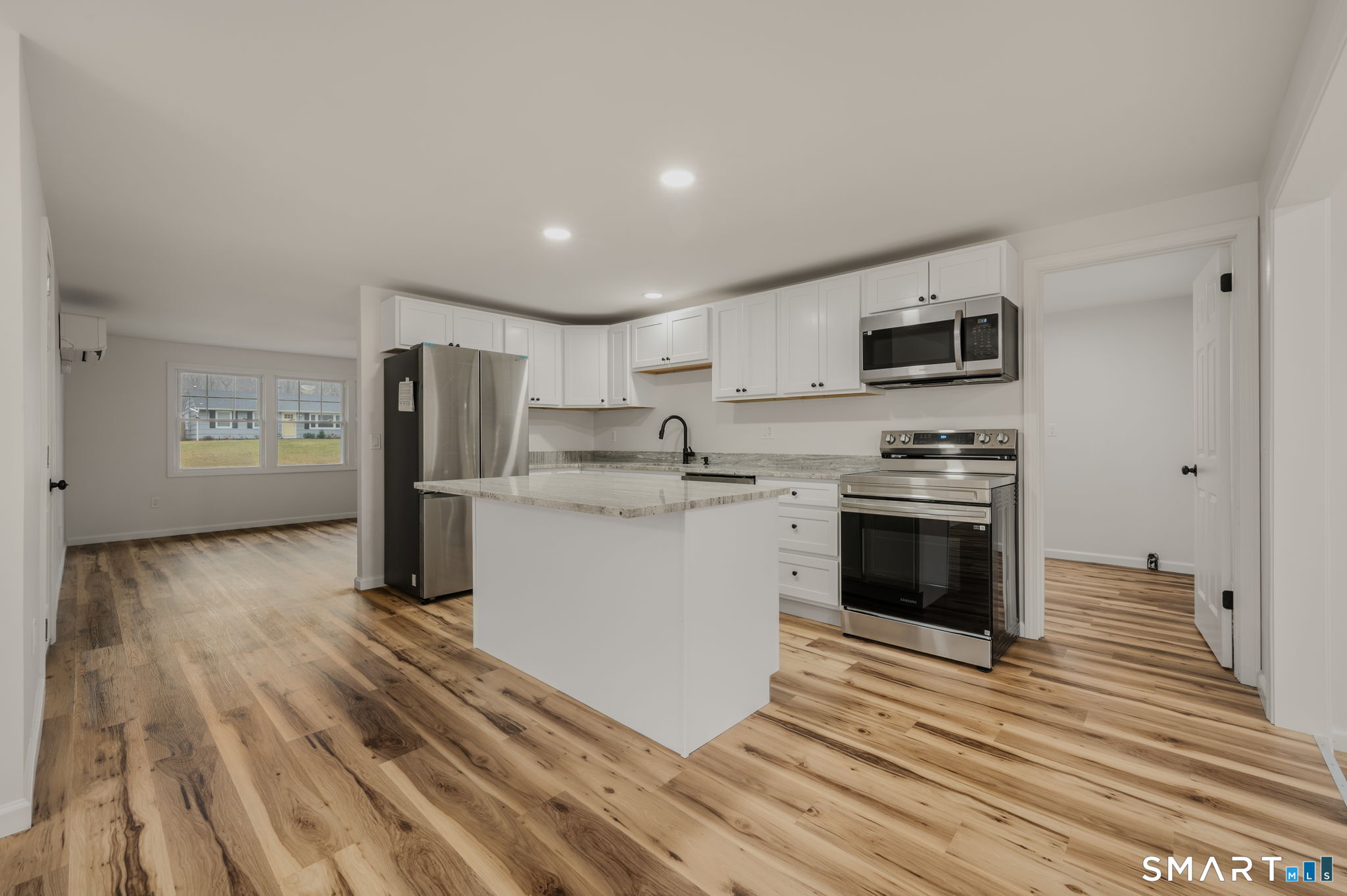 153 Meeting House Lane Ledyard, CT 06339 - Photo 15 of 39 a kitchen with stainless steel appliances a refrigerator stove and sink