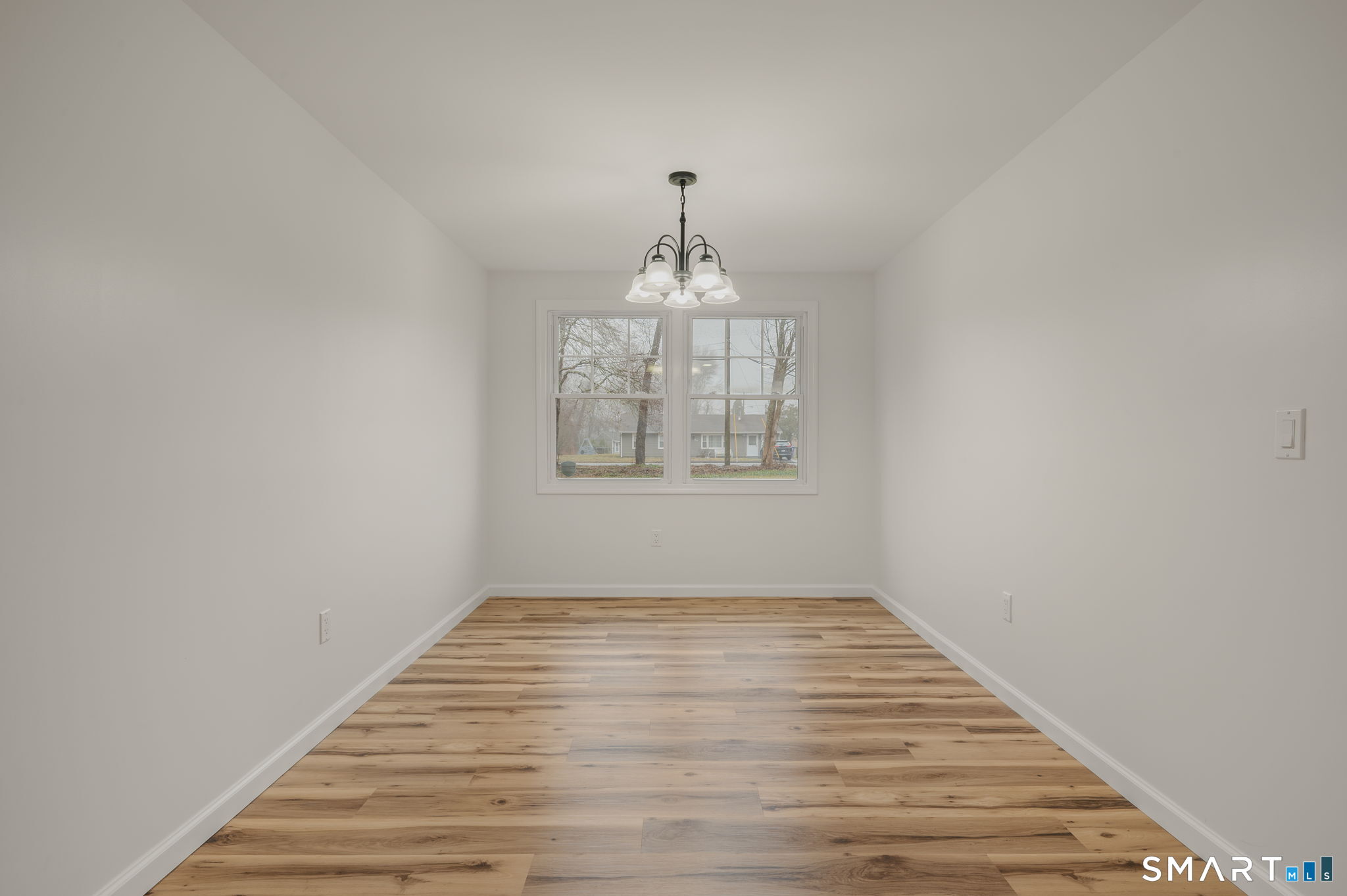 153 Meeting House Lane Ledyard, CT 06339 - Photo 16 of 39 wooden floor in an empty room with a window