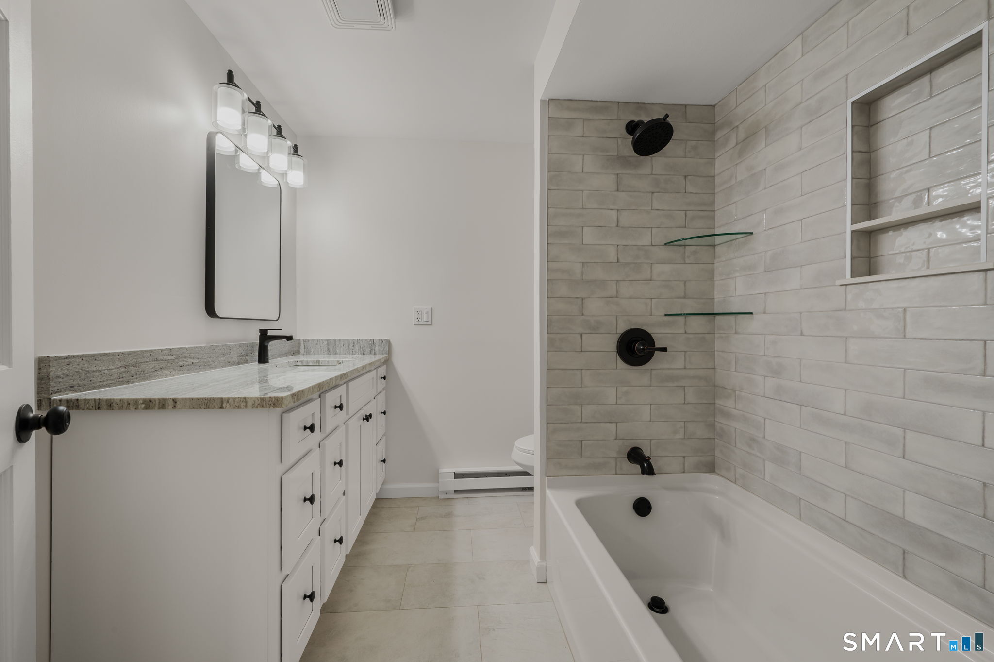 153 Meeting House Lane Ledyard, CT 06339 - Photo 29 of 39 a bathroom with a tub sink double vanity and shower