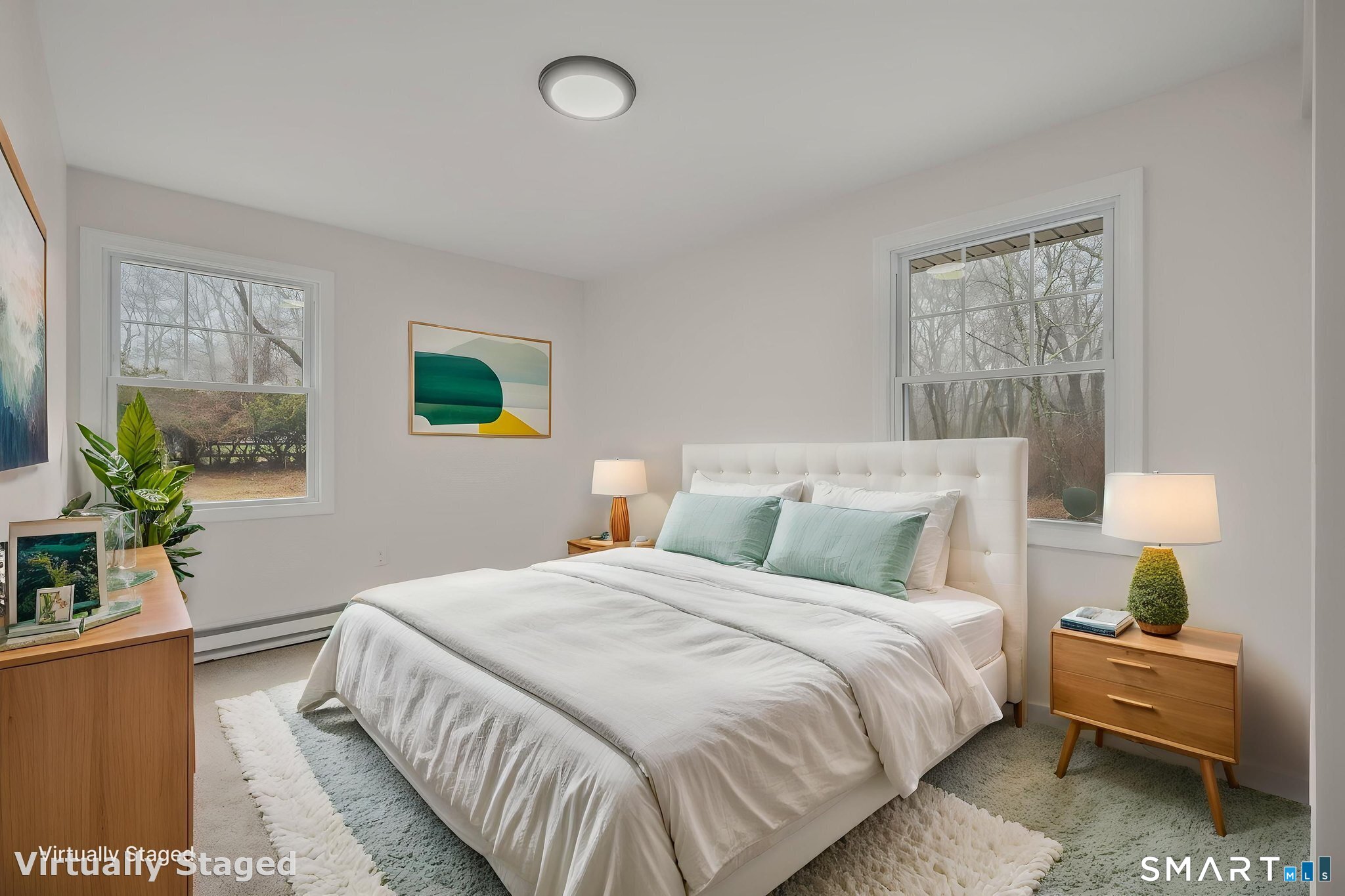 153 Meeting House Lane Ledyard, CT 06339 - Photo 33 of 39 a bedroom with a bed and a potted plant