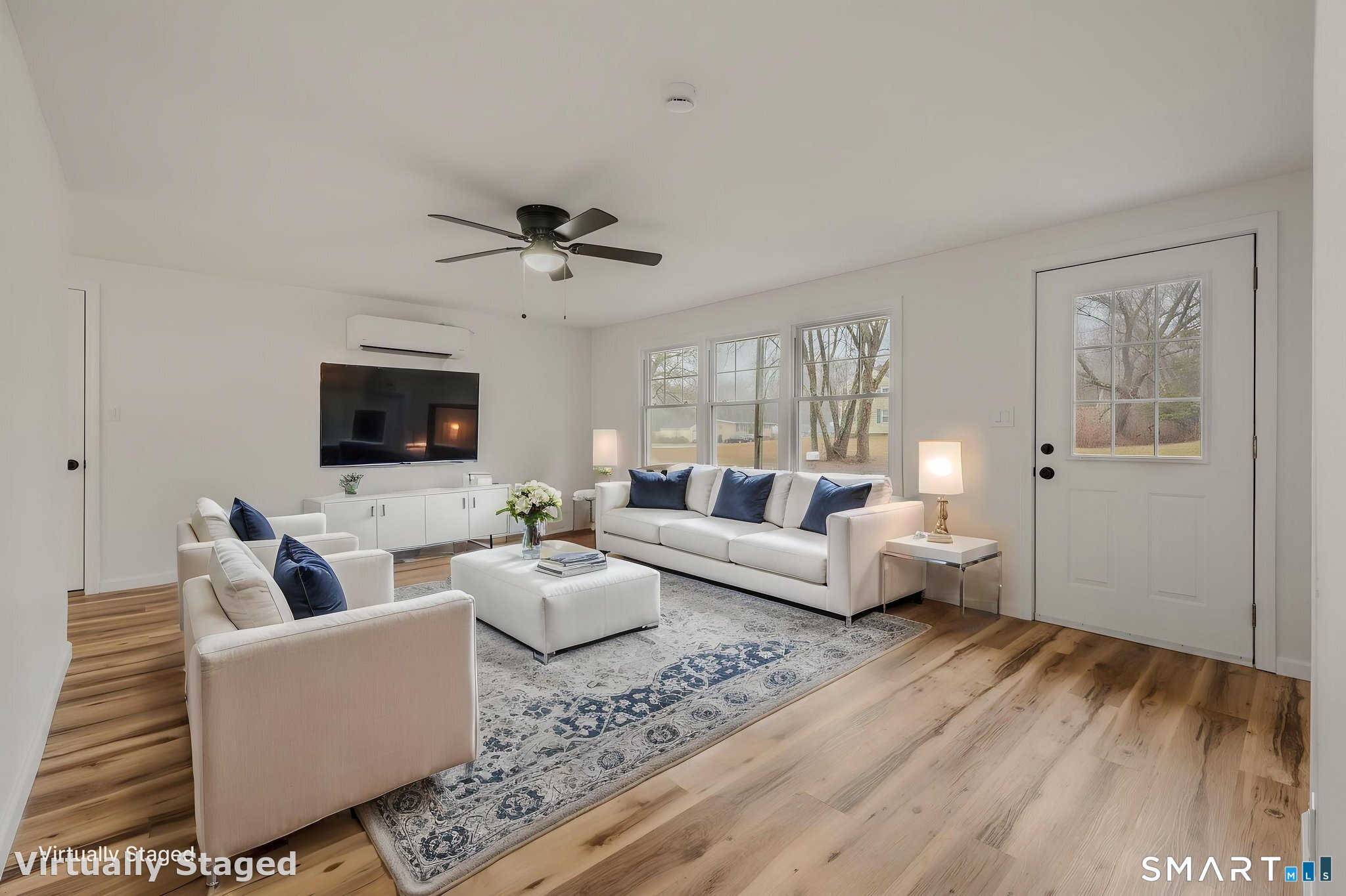 153 Meeting House Lane Ledyard, CT 06339 - Photo 7 of 39 a living room with furniture and a flat screen tv