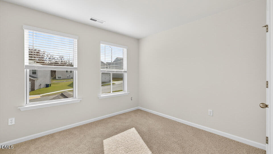 6037 Sodium Street Raleigh, NC 27610 - Photo 17 of 27 an empty room with windows