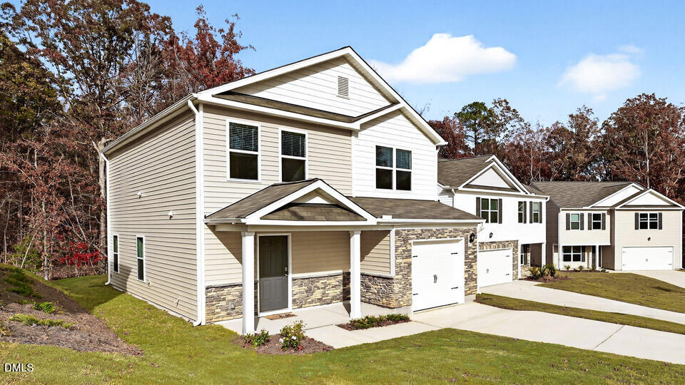 6037 Sodium Street Raleigh, NC 27610 - Photo 2 of 27 a front view of a house with a yard
