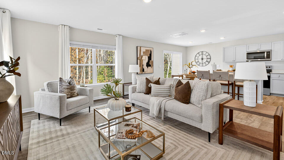 6037 Sodium Street Raleigh, NC 27610 - Photo 4 of 27 a living room with furniture and a window