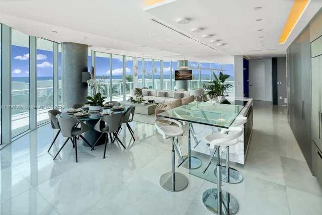 a view of a dining room with furniture window and outside view