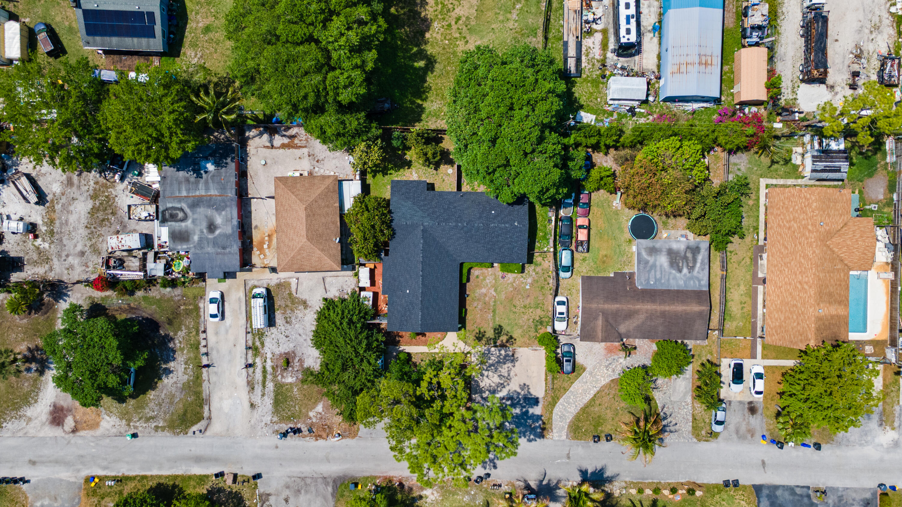 4453 Stevens Road Lake Worth Beach, FL 33461 - Photo 5 of 67 an aerial view of a house with a yard and large trees
