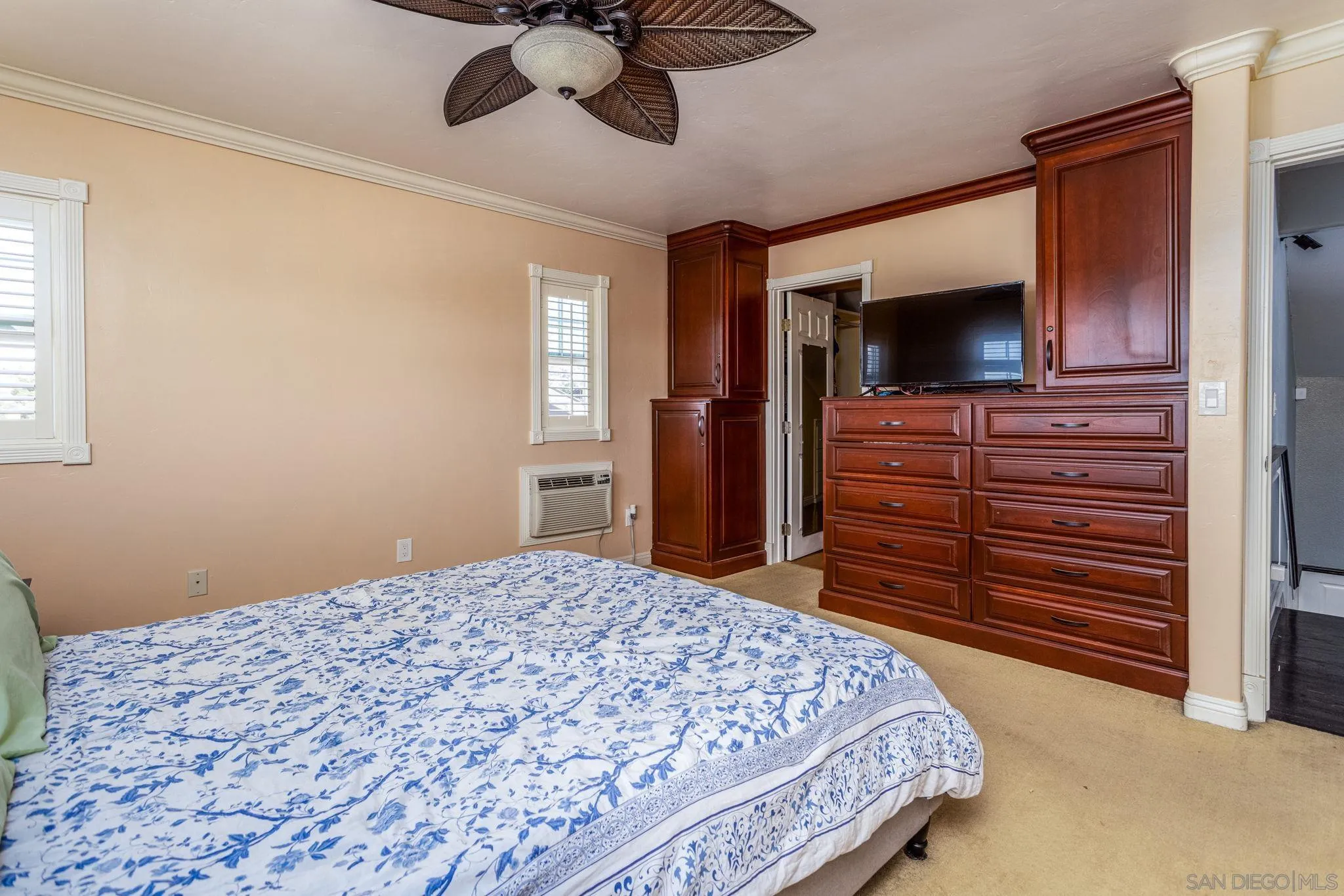 532 Kempton Street Spring Valley, CA 91977 - Photo 20 of 30 a bedroom with a bed and a flat screen tv