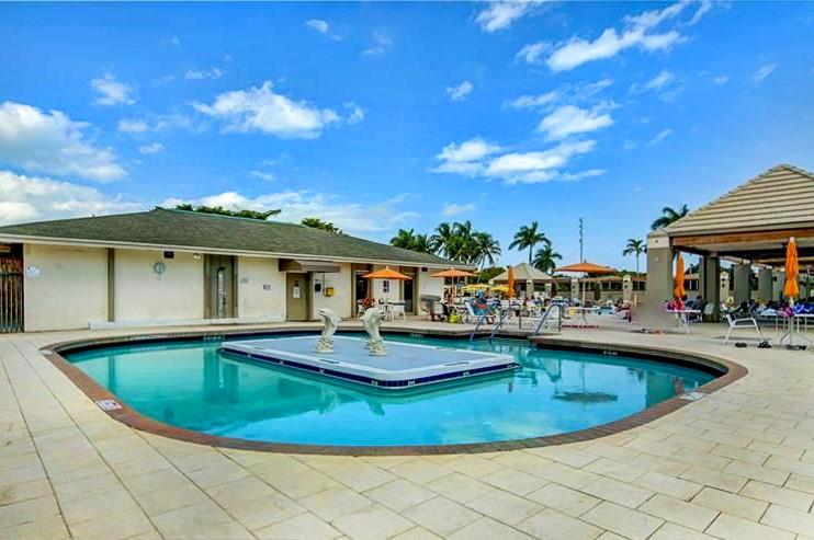 1902 Bermuda Circle, Unit G2 Coconut Creek, FL 33066 - Photo 14 of 15 a view of a house with swimming pool and sitting area