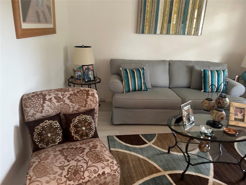 1902 Bermuda Circle, Unit G2 Coconut Creek, FL 33066 - Photo 6 of 15 a living room with furniture and a rug