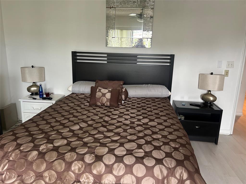 1902 Bermuda Circle, Unit G2 Coconut Creek, FL 33066 - Photo 7 of 15 a bedroom with a bed and window