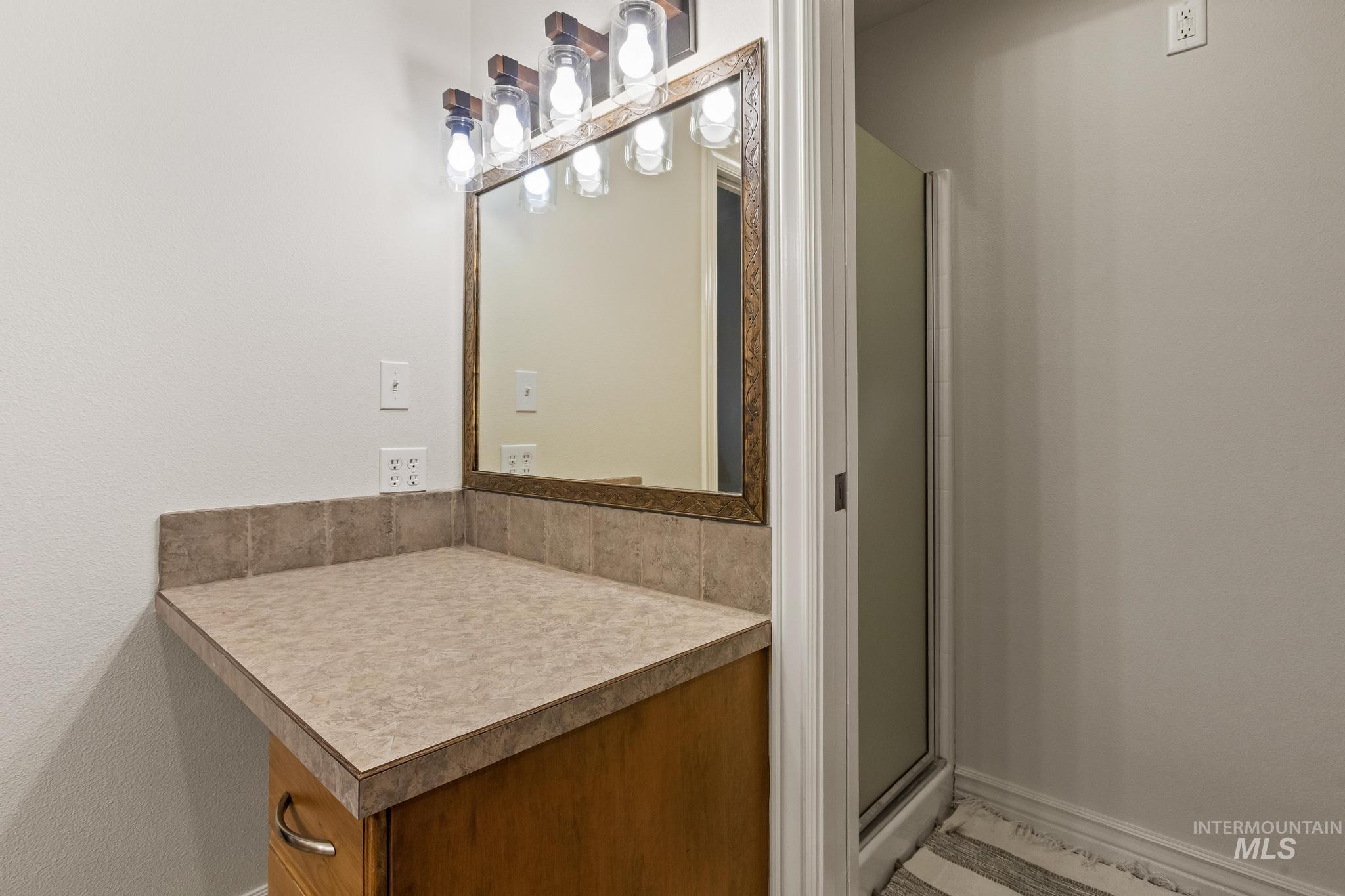 2185 Waterwheel Road Emmett, ID 83617 - Photo 25 of 49 Bathroom featuring a stall shower and vanity