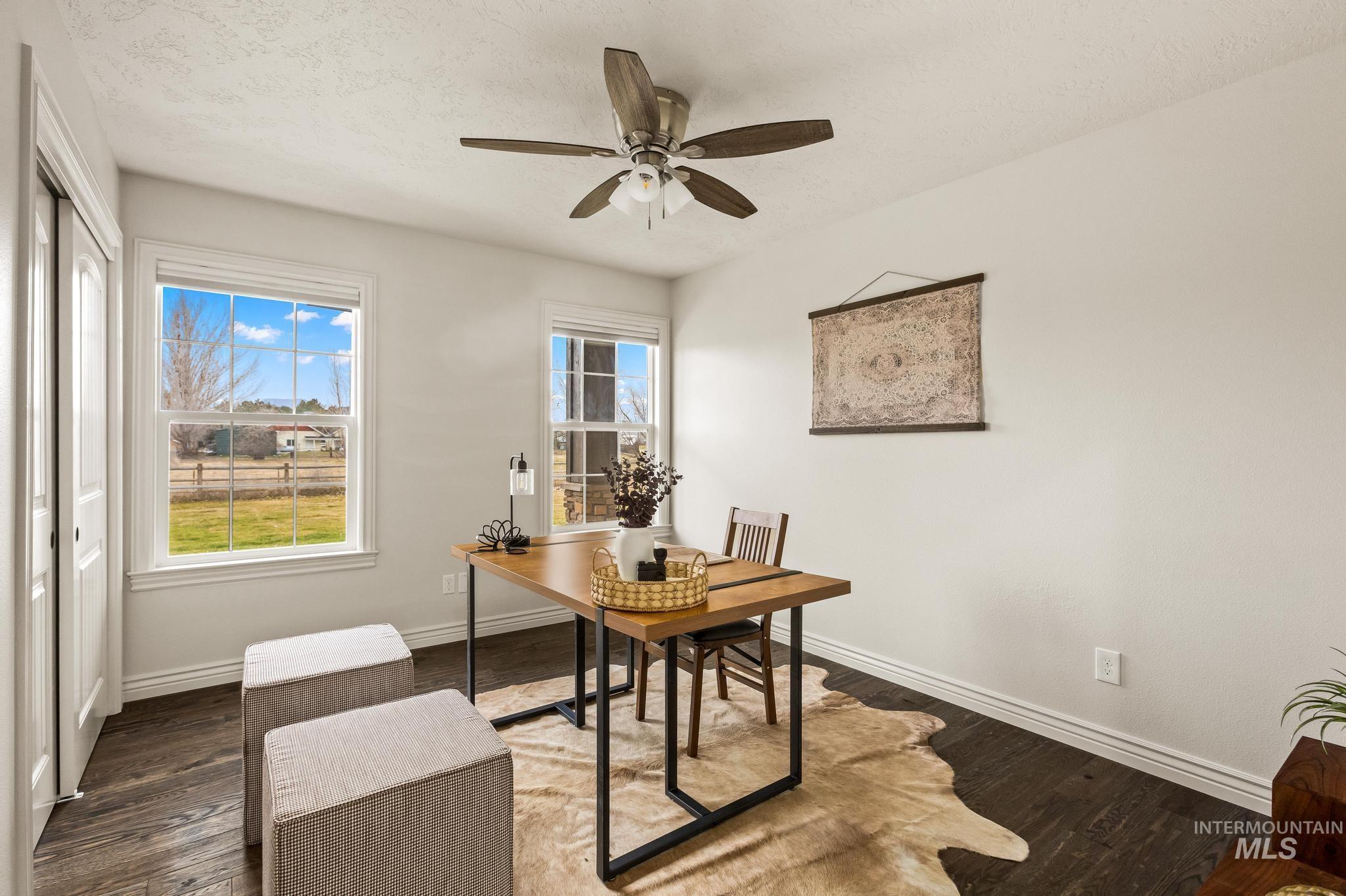 2185 Waterwheel Road Emmett, ID 83617 - Photo 28 of 49 Home office featuring wood finished floors, a ceiling fan, and a textured ceiling