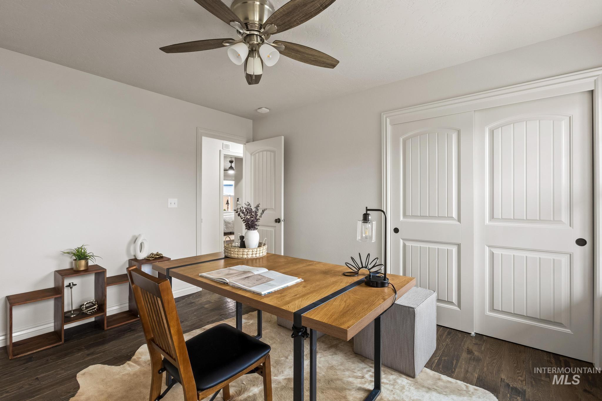2185 Waterwheel Road Emmett, ID 83617 - Photo 29 of 49 Dining area with dark wood-style flooring and ceiling fan