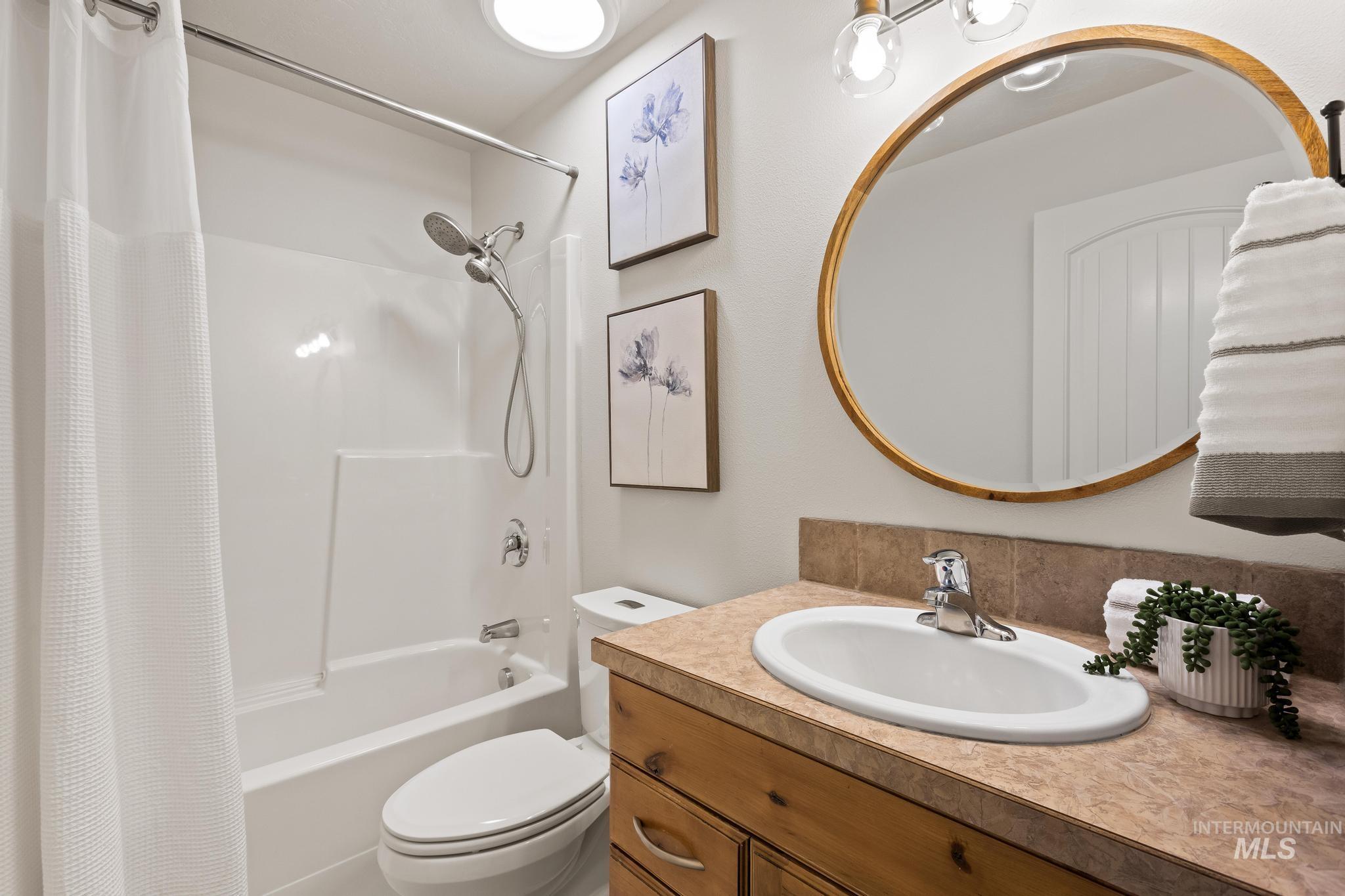 2185 Waterwheel Road Emmett, ID 83617 - Photo 31 of 49 Full bathroom with shower / bath combination with curtain and vanity