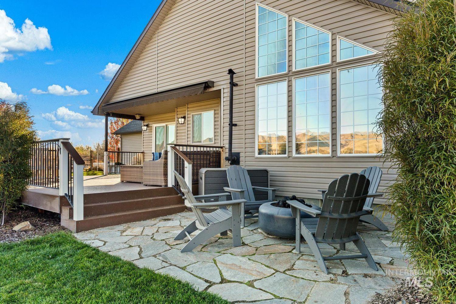 2185 Waterwheel Road Emmett, ID 83617 - Photo 41 of 49 Rear view of house with an outdoor fire pit, a patio area, and a deck