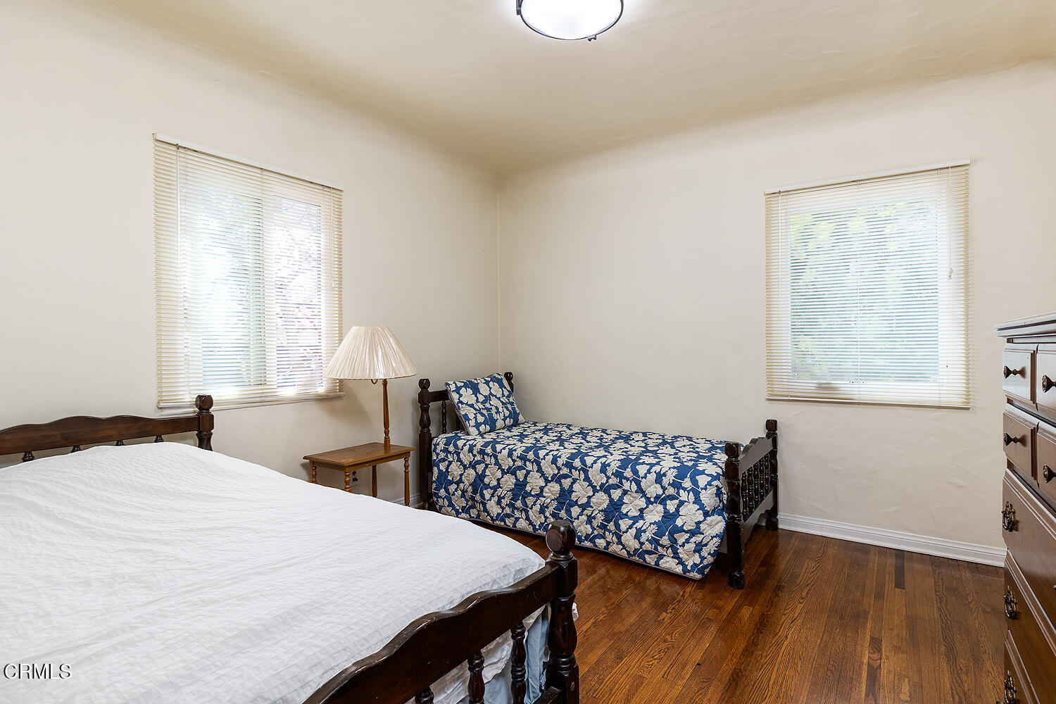 824 Palm Drive Glendale, CA 91202 - Photo 17 of 24 a bedroom with a bed and wooden floor