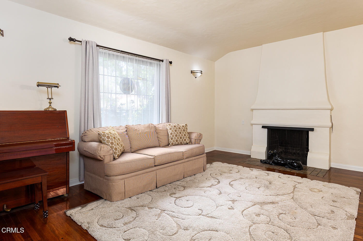 824 Palm Drive Glendale, CA 91202 - Photo 5 of 24 a living room with a couch a fireplace and a window