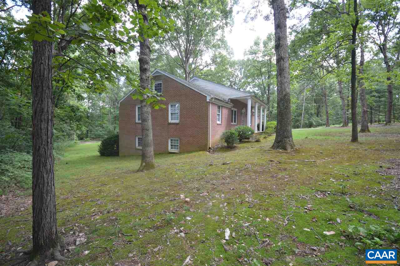 857 Advance Mills Road Ruckersville, VA 22968 - Photo 3 of 42 a view of a yard in front of a house with large tree