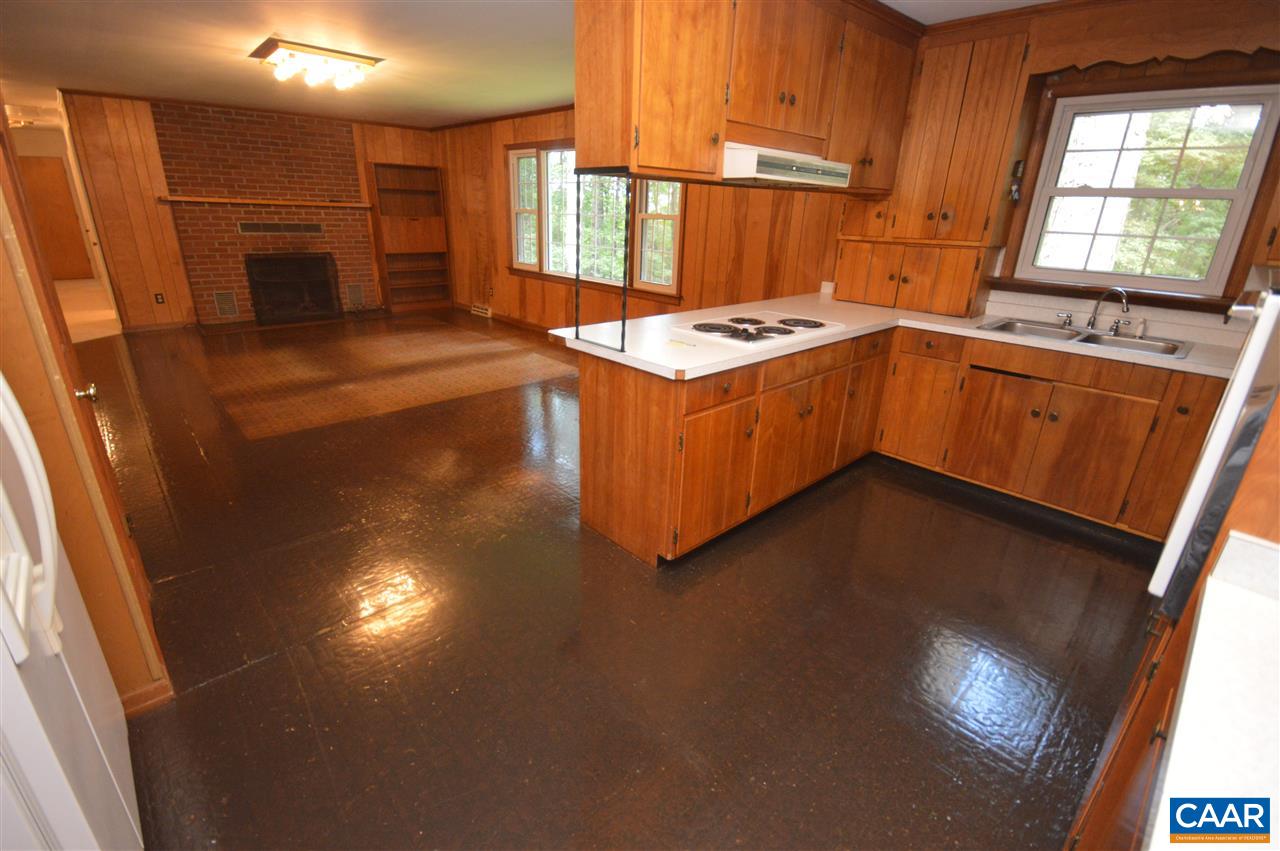 857 Advance Mills Road Ruckersville, VA 22968 - Photo 6 of 42 a kitchen with stainless steel appliances a stove a sink dishwasher and a refrigerator with wooden floor
