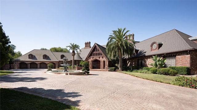 a view of multiple house with palm trees