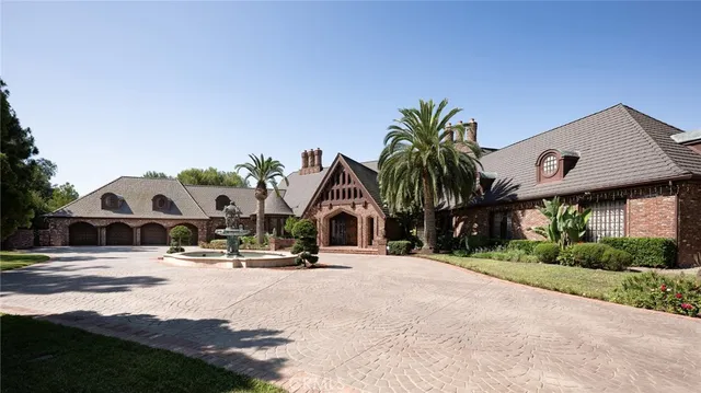 a view of multiple house with palm trees
