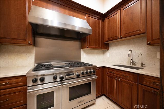 a spacious bathroom with a granite countertop sink and a large mirror