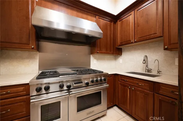 a spacious bathroom with a granite countertop sink and a large mirror