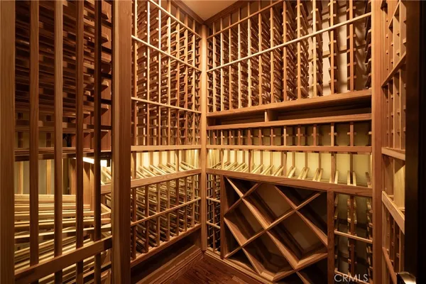 a view of hallway with wooden floor and stairs