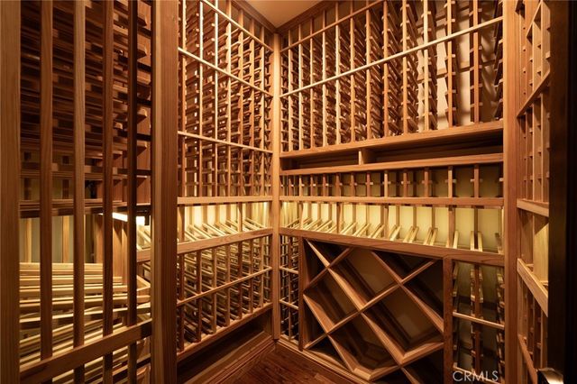 a view of hallway with wooden floor and stairs