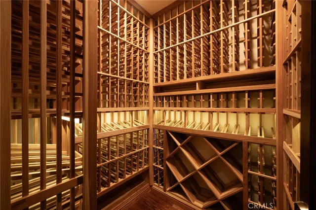 a view of hallway with wooden floor and stairs