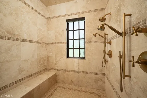 a view of kitchen with stainless steel appliances kitchen island wooden floor and window