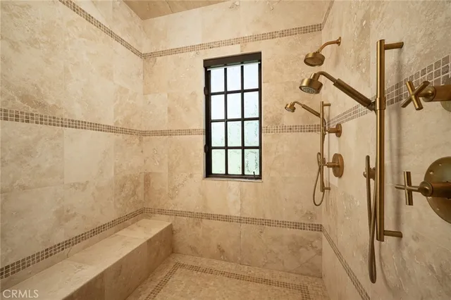 a view of kitchen with stainless steel appliances kitchen island wooden floor and window